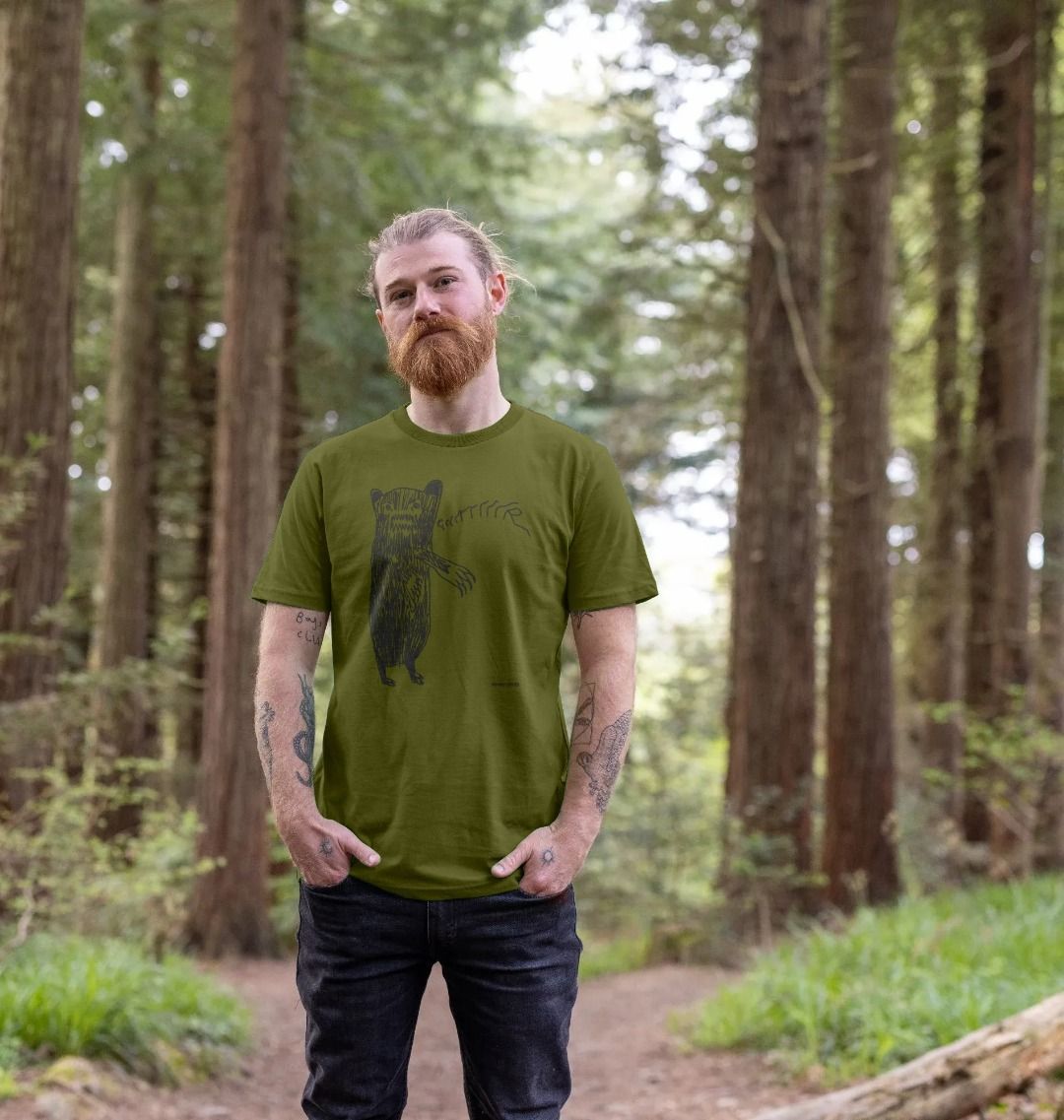 Man standing in a forest clearing wearing a Moss Green Grrrrrrr Bear AKA 'Brian' organic cotton t-shirt